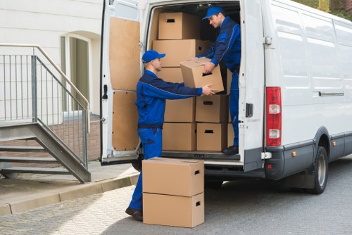 Local movers handling furniture in a Lambeth flat