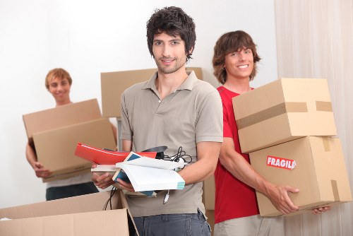 Packed moving boxes and furniture ready for house removals in Lambeth