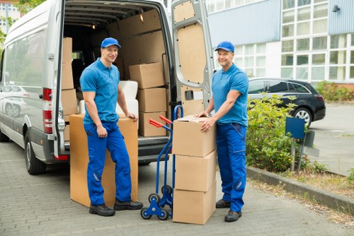 Staff checking access and handling risks before a move