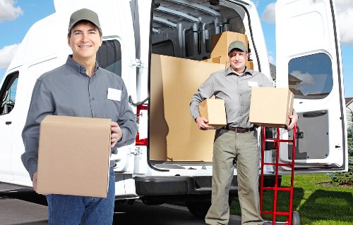 Local moving truck loading furniture and boxes in Lambeth