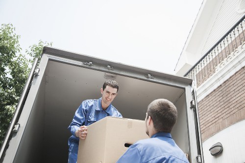 Unpacking support in a Lambeth flat with boxes arranged room by room